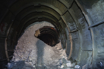 Naklejka premium The collapse in the chalk mine, tunnel with traces of drilling machine