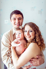 Fototapeta premium parents holding the baby
