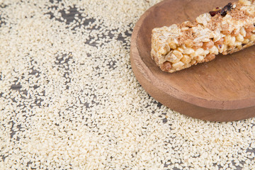 Seeds of sesame and bar of cereal