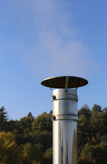 chimney steel with polluting smoke coming out