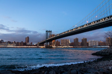Manhattan Bridge and Manhattan Skyline at sunset - New York, USA