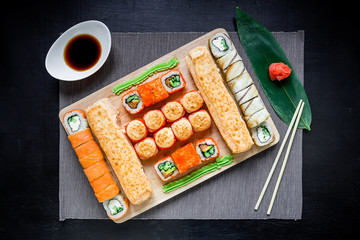 Set of japanese food on a dark background. Asian food background. Top view. Flat lay
