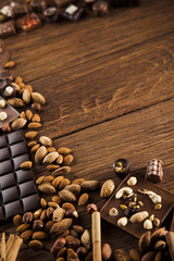 Fototapeta na wymiar Praline Chocolate on wooden backgroud