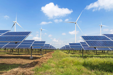 solar cells and wind turbines generating electricity in  power station alternative renewable energy...