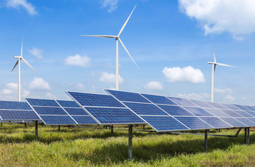 solar cells and wind turbines generating electricity in power station