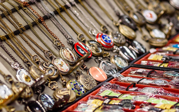 Many pocket watches on chains on display and for sale at a market stall in Melbourne Australia
