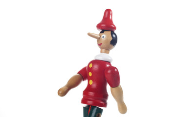 Wooden Pinocchio doll isolated on white background.