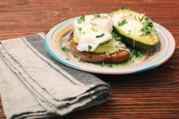 Sandwich with avocado and a fried egg