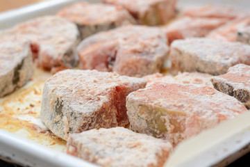 Fish steaks covered with wheat flour and bread crumbs