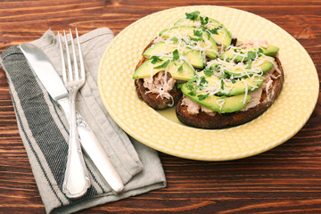 Open avocado sandwiches with tuna on whole grain bread