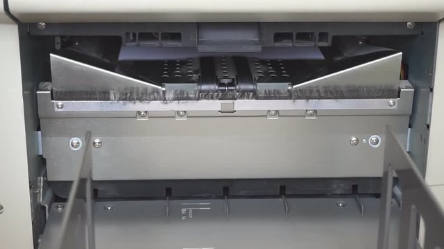 Machine working in print shop
