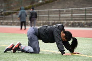 Young Female Exercising and Training at the Track
