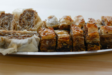 Traditional serbian cake baklava arranged on metal plate.