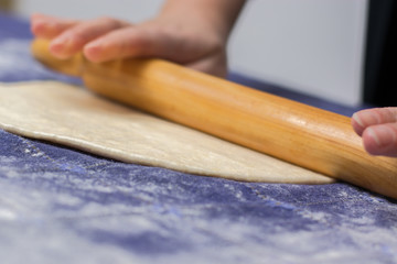 Creating homemade Phyllo or strudel dough on a home table cloth