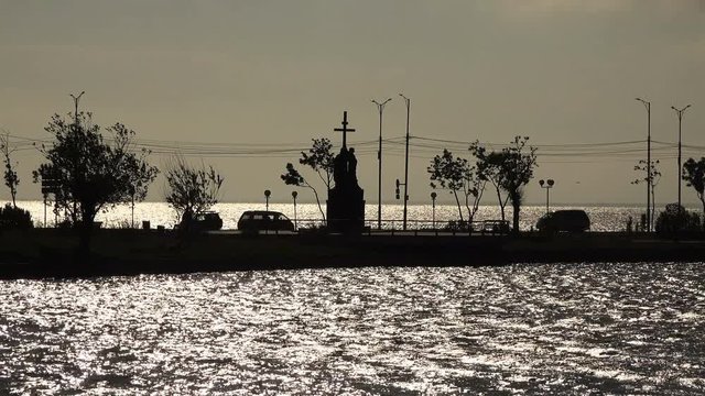 lane highway with a waterfront architectural monument washed with water