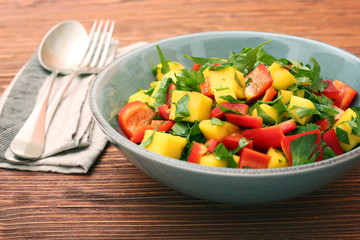 Mango salad with pepper and parsley in a bowl