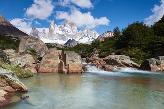 Wide angle long exposure landscape featuring Monte Fitz Roy in the background and clear water river in the foreground, Patagonia, Argentina