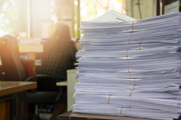 Business Concept, Pile of unfinished documents on office desk, Stack of business paper