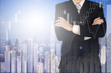 Plakat Double exposure of businessman arms crossed and stand up with cityscape and financial graph background