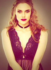 Close up portrait of beautiful young woman face. Isolated on gray background.