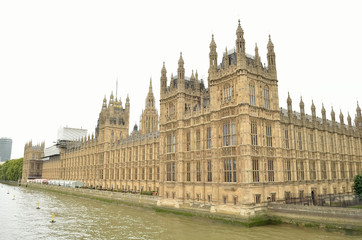 Fototapeta na wymiar British house of Parliament besides Thames river