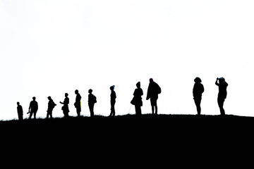 silhouette group of hiking on mountain with white background, subject is blurred