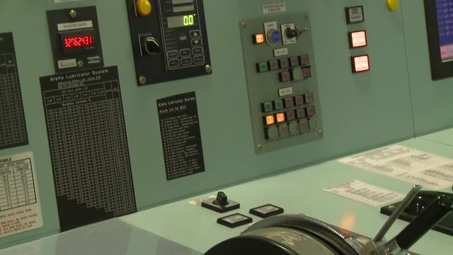 Navigation elements inside of the bridge of a cargo ship. The bridge of the cargo ship is the platform from which the ship is commanded.