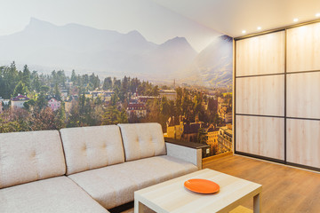 The interior of the living room in orange tones with sofa - obrazy, fototapety, plakaty
