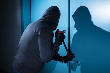 Thief Trying To Break The Door