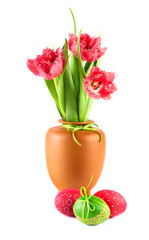 Fototapeta na wymiar Red fluffy tulips and painted Easter eggs on white