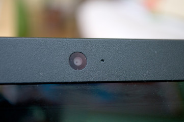 Focus camera on black laptop with a blurred background