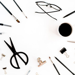 White office desk frame with supplies. Coffee, scissors, pen, clips, glasses and office supplies on white background. Flat lay, top view office table desk.