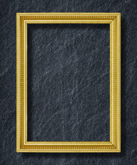 Fototapeta premium gold frame on black slate background