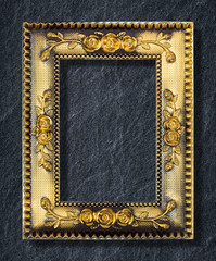 gold frame on black slate background
