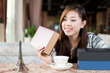 young pretty woman sits in cafe