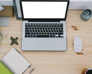 Laptop and coffee cup on wood table with copy-space.