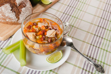 Mexican soup with chicken, celery and vegetables