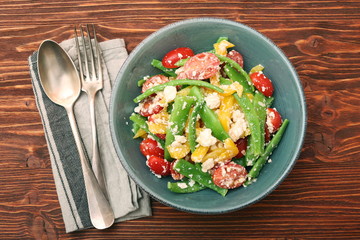 Snow pea salad with feta, tomato and pepper