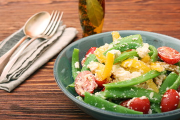 Snow pea salad with feta, tomato and pepper