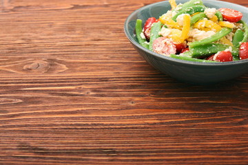 Snow pea salad with feta, tomato and pepper