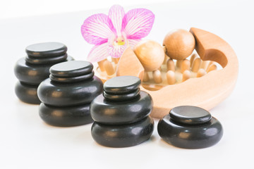 Spa treatment with hot stones, massage roller and cellulite massager 