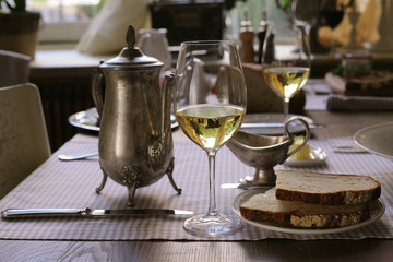  white wine, vintage teapot and some bread