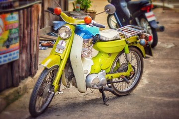 Classic motorcycle on the road in vintage color style