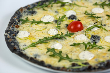 Black cheese pizza on white background