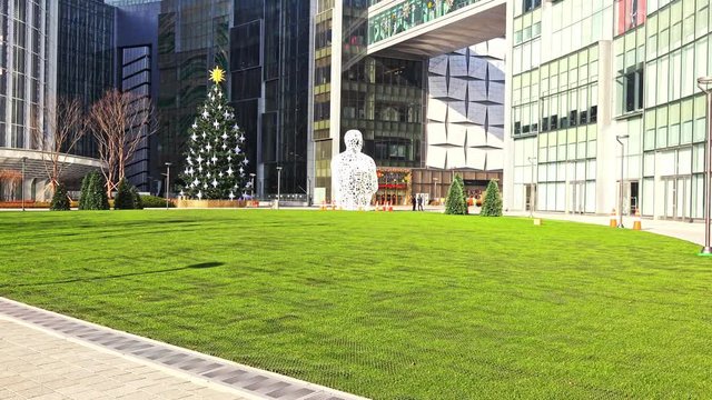 4K of facade Lotte World Tower Korea's Tallest Building with christmas tree and blue sky, Lotteworldtower is the tallest building in South Korea