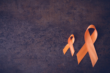 Orange Ribbons on toning background, Leukemia awareness, Self Injury Awareness Day, Multiple...