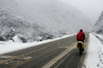 cycling on snow road, china