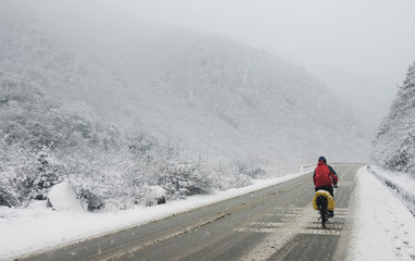alone cycling in snow, china