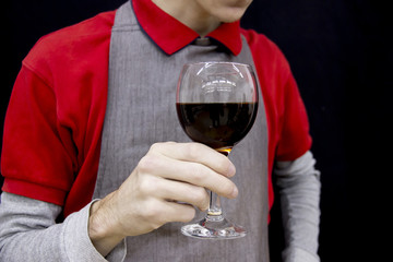 Barista holding freshly brewed coffee in glasses