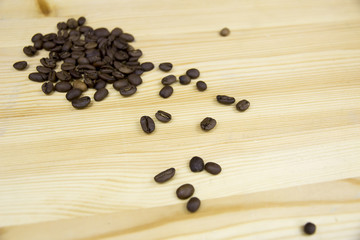 Scattered coffee beans on table